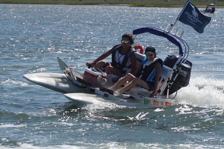 Woman and boy on catamaran