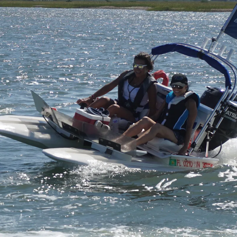 Woman and boy on catamaran