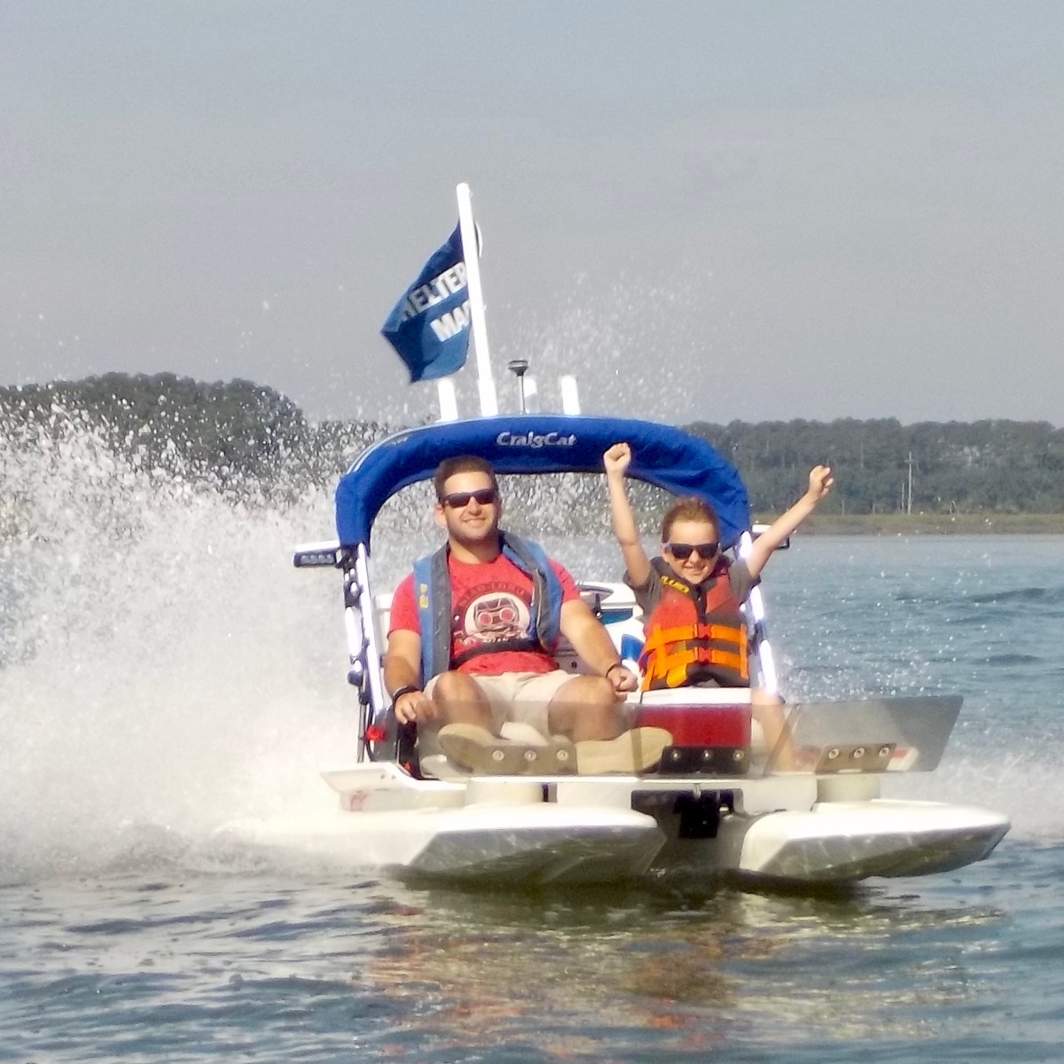 Man and Boy on catamaran