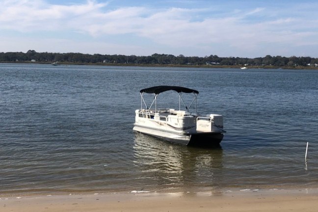 a small boat in a body of water