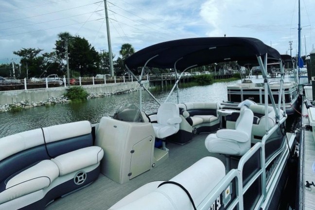 a train is parked on the side of a boat