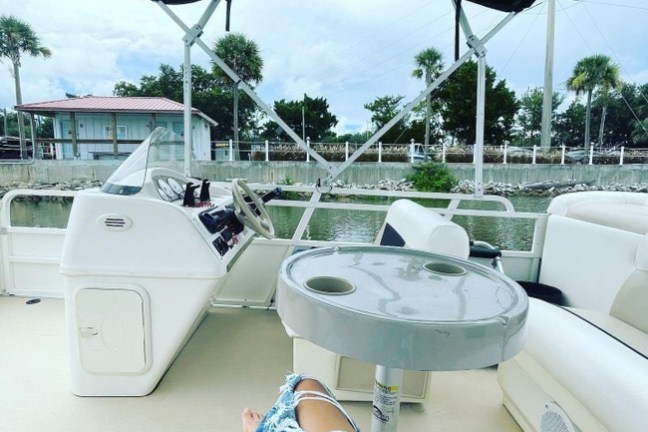 a boat sitting on top of a car