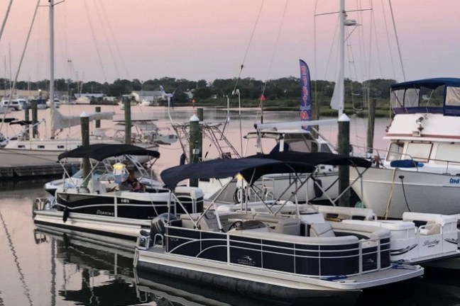 a boat is docked next to a body of water