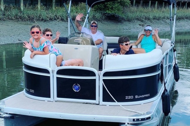 a group of people on a boat in the water